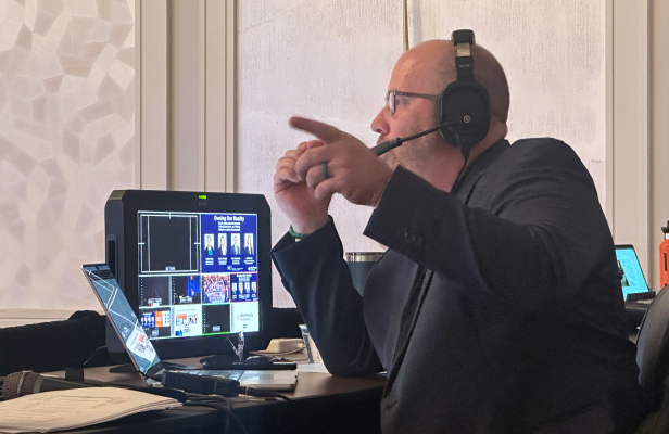 Event production manager coordinating a live event
