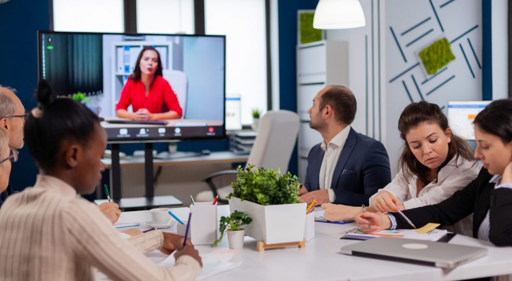Manager woman sitting in front of camera talking on video call Manager woman sitting in front of camera talking on video call during virtual conference working Business people talking to webcam, do online conference participate internet brainstorming, distance office discussion.
